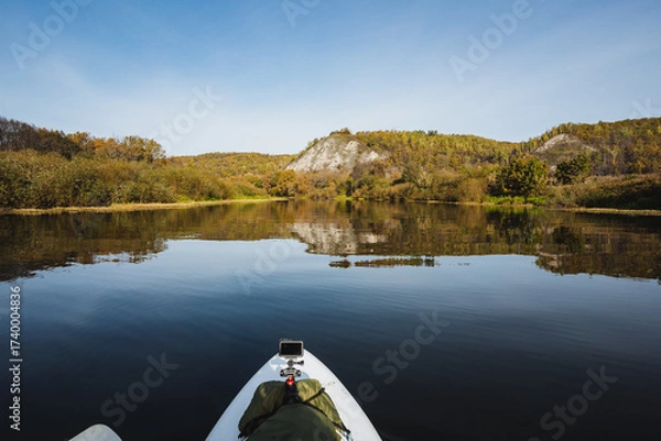 Fototapeta Autumns beauty radiates in a tranquil lake surrounded by vibrant greenery and majestic mountains, creating an ideal setting for adventure and relaxationa perfect nature getaway for all