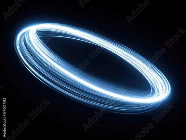 Fototapeta Bright blue light trails create a glowing, orbiting ring against a dark, black background