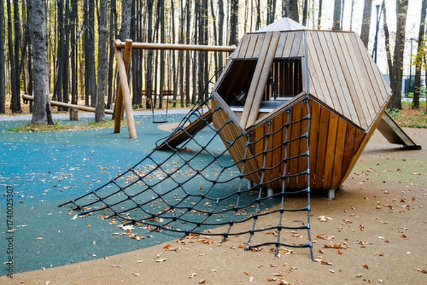Fototapeta An imaginative and truly unique modern playground structure nestled in a serene environment, surrounded by beautiful trees, inviting children to explore and embark on exciting adventures in nature