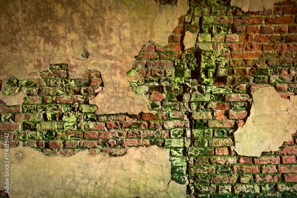 Obraz Brick wall with peeling plaster