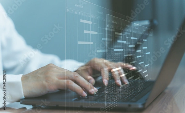 Fototapeta Business technology concept with hands typing on laptop and digital interface.