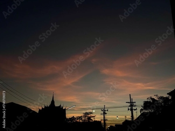 Fototapeta A serene evening atmosphere before sunset in Pak Phanang, Nakhon Si Thammarat, Thailand, captured on October 7, 2025, around 6 PM.