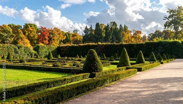 Fototapeta Beautiful Formal Garden with Green Hedges and Colorful Trees in Autumn