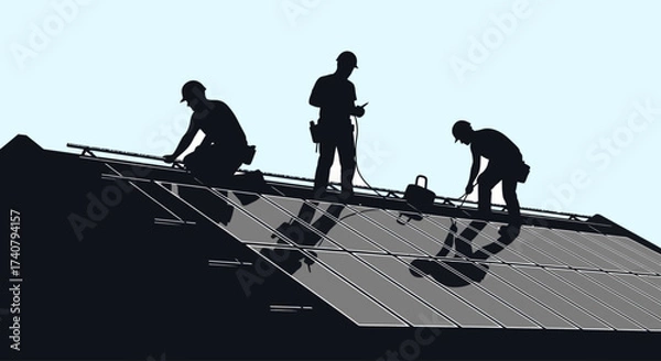 Fototapeta Silhouette of construction workers installing solar panels on rooftop against clear sky