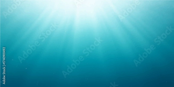 Fototapeta Bright sunlight beams through the deep blue ocean water, illustrating an underwater sea world background with rays