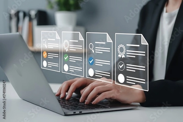 Fototapeta Businesswoman reviewing digital documents and data on a laptop screen