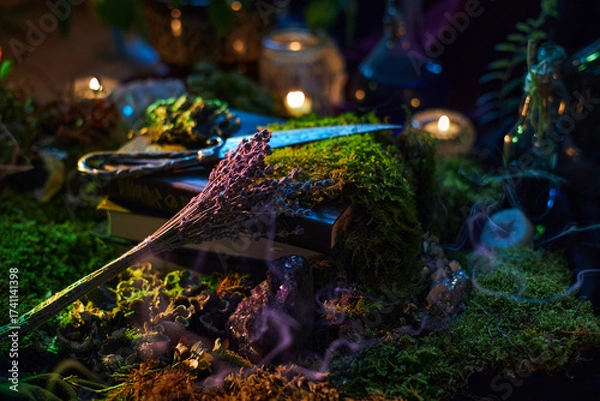 Fototapeta mystical tabletop scene features open books, dried herbs, and glowing candles. Soft smoke lingers as natural elements create a tranquil, magical environment