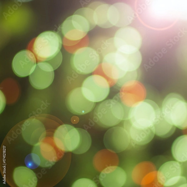 Fototapeta Vibrant Bokeh Effect Background: Defocused Green and Gold Lights with Gentle Lens Flares. Abstract Festive Illumination for Design Projects.