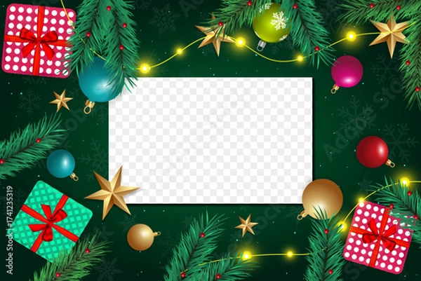 Fototapeta Christmas evergreen boughs and ornamentals frame a transparent center area for text or media