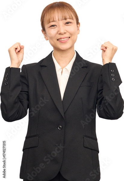 Fototapeta ビジネススーツを着た女性のガッツポーズ