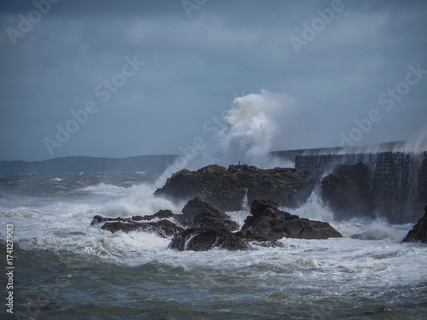 Fototapeta crashing waves over Holyhead breakwater isle of Anglesey
