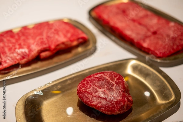 Fototapeta Raw Sirloin Hanwoo Beef, marbled Korean Style Meat prepared on the plate