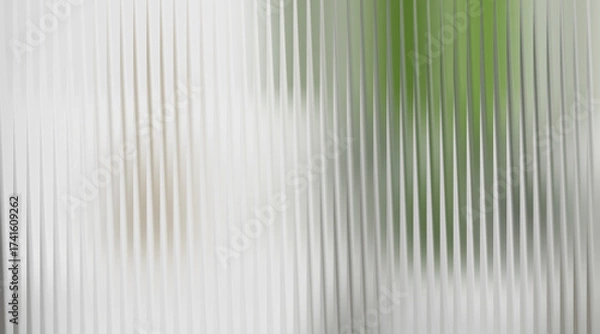 Fototapeta Abstract background with vertical ribbed texture and green blur