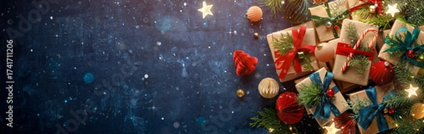 Fototapeta Dark blue Christmas background with gift boxes and fir branches.Merry Christmas.Happy new year banner