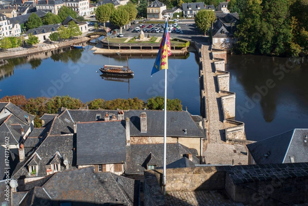 Fototapeta View of the town of Terrasson in the Dordogne region of France, with its typical rooftops, river and bridges