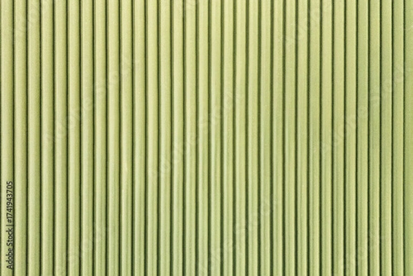 Fototapeta Green corrugated texture background with vertical lines.