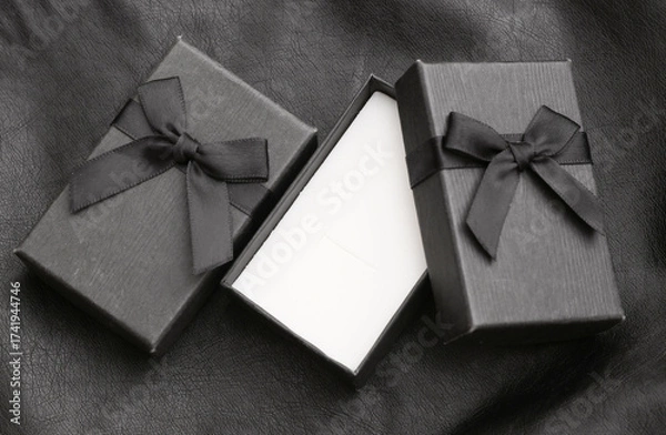 Fototapeta Open Gift box on black leather background