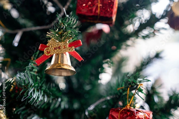 Fototapeta Beautifully decorated Christmas tree with lights and ornaments, creating a warm festive atmosphere for Christmas and New Year celebration.