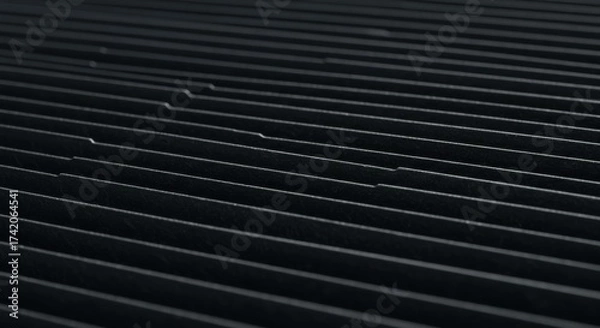 Obraz Black textured surface with parallel lines and subtle reflections  