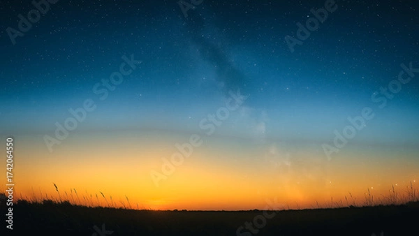 Fototapeta An awe-inspiring vista unfolds at dusk, as the radiant sun bids farewell below the horizon. The landscape is transformed into a mesmerizing expanse of twilight, inviting serenity.