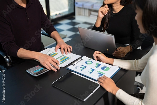 Fototapeta Co-workers are consultants on business documents, tax, transactions and business combinations after a bankrupt merger with a newly founded company.