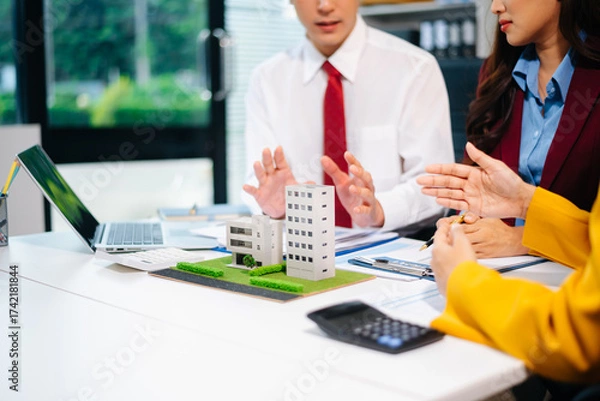 Fototapeta Salesman Hands On comdo House Model , Small Toy House Small Mortgage Property insurance and concepts real estat