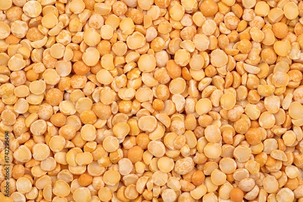 Fototapeta Dry yellow split peas background