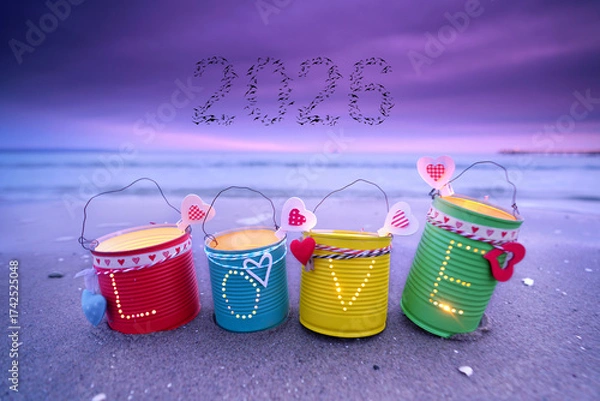 Fototapeta Shimmering LOVE Lanterns Crafted from Tin Cans on the beach for new year 2026