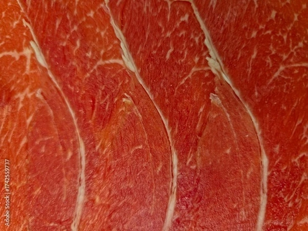 Fototapeta  Close-Up of Thinly Sliced Raw Beef Brisket.