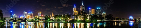 Fototapeta A beautiful view of Melbourne downtown across the Yarra river at night in Melbourne, Victoria, Australia.