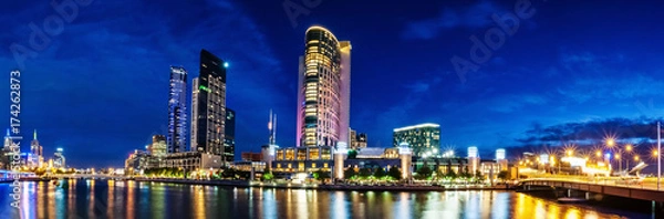 Fototapeta A beautiful view of Melbourne downtown across the Yarra river at night in Melbourne, Victoria, Australia.