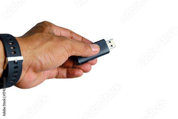 Fototapeta Close Up Of Hand Holding USB Flash Drive For Data Transfer And Digital Storage