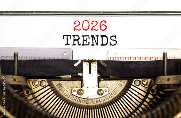 Fototapeta 2026 Trends new year symbol. Concept words 2026 Trends typed on beautiful old retro typewriter. Beautiful white background. Beautiful old typewriter. Business 2026 Trends new year concept. Copy space.