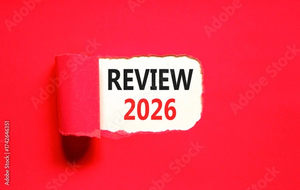 Fototapeta Review 2026 symbol. Concept words Review 2026 on beautiful white paper. Beautiful red paper background. Business and review 2026 concept. Copy space.