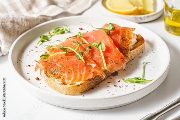 Fototapeta bruschetta with salmon on a white background