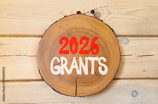 Fototapeta 2026 Grants symbol. Concept words 2026 Grants on beautiful wooden circle. Beautiful wooden wall background. Business and 2026 grants concept. Copy space.