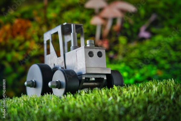 Fototapeta A whimsical macro scene where a toy tractor meets a mushroom forest—blending childhood, fantasy, and industry in a playful visual metaphor. Ideal for themes of creativity, storytelling, and innovation