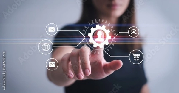 Fototapeta Innovation at Your Fingertips: A woman's hand, poised to activate a digital interface that promises streamlined technological advancement and human-centric automation.