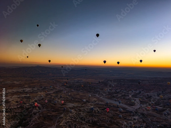 Fototapeta Balloons in Cappadocia at sunrise