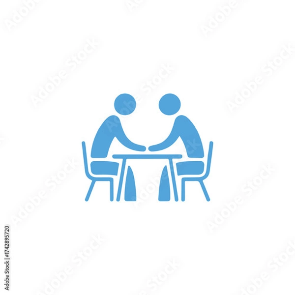 Fototapeta Two people seated at a table facing each other in discussion