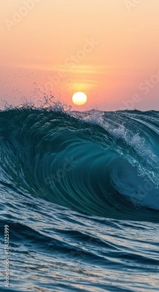 Obraz Close up view of a clear blue wave crashing and spraying water in the ocean at sunrise or sunset. Powerful liquid motion and serene nature scene. World Oceans Day.