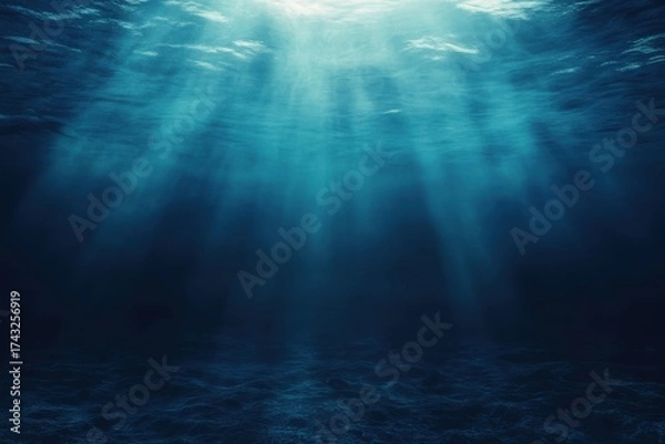 Fototapeta Underwater scene with sunlight beams shining through deep ocean surface great for marine and nature visuals