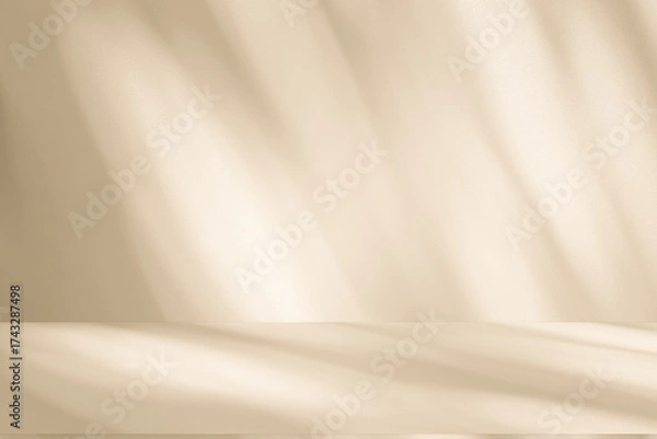 Fototapeta Wall interior background, studio and backdrops show products. with leaf shadow from window color beige and white. background for text insertion and presentation of product	