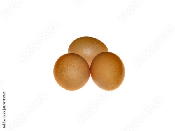 Obraz three brown eggs, isolated on white background