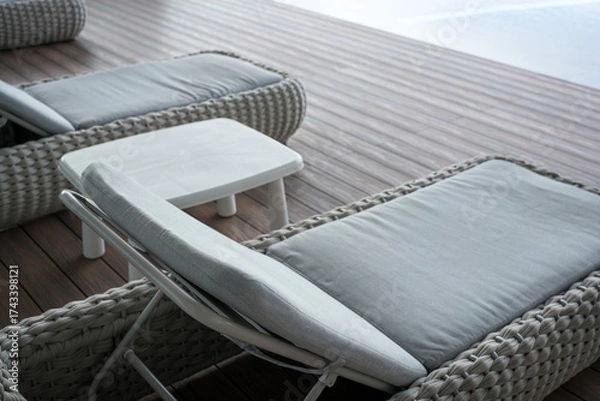 Fototapeta Wicker Loungers and Table on Wooden Deck