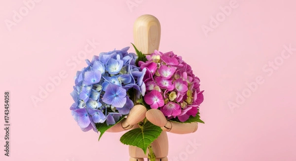 Fototapeta Wooden mannequin holds two colorful hydrangea flower bouquets contrasting colors