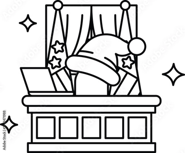 Fototapeta A man in a Santa hat sits at a desk with a laptop