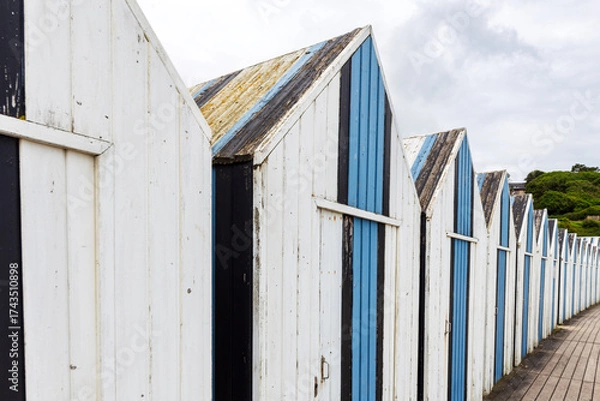 Fototapeta Close-up of vintage beach changing rooms on Yport’s beach, alabaster coast, department of Seine Maritime, Normandy region, France.