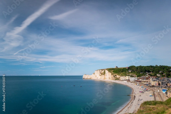 Fototapeta The beach of Etretat with the Amont Cliffs, natural rock arch of the alabaster coast, department of Seine Maritime, Normandie region, France.
