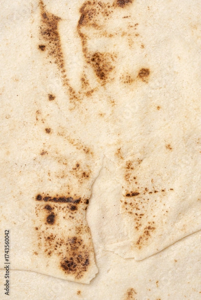 Fototapeta Thin lavash isolated on white background. Armenian unleavened lavash. Lavash as textured bread background.	